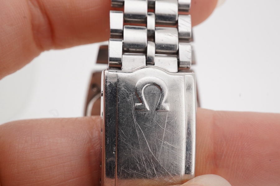 A gentleman's 1970;s stainless steel Omega Constellation automatic wrist watch, with baton numerals and date aperture, case diameter 34mm, on a stainless steel Omega bracelet, no box or papers.